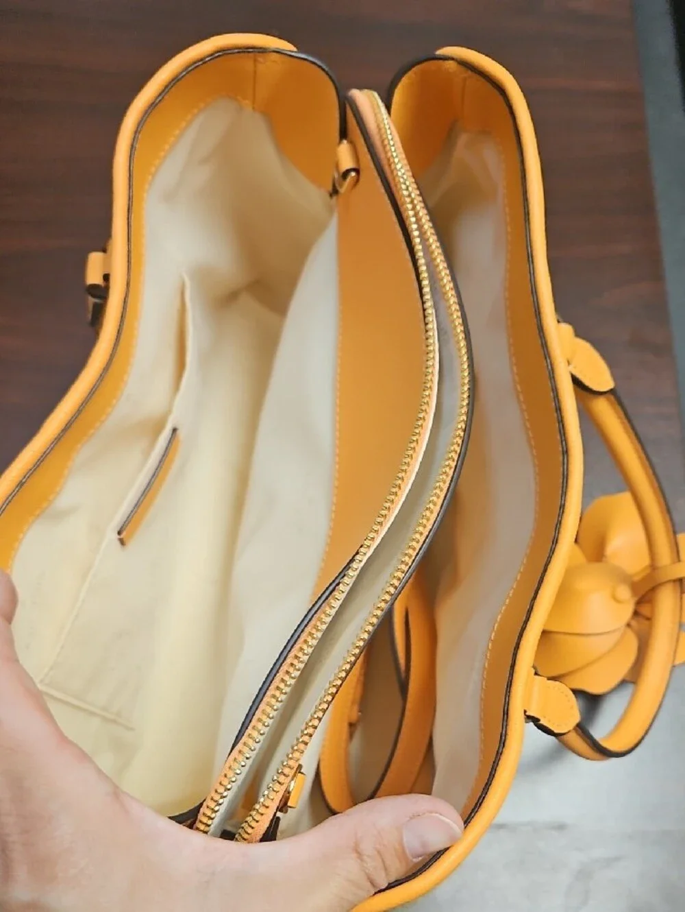 Kate Spade. Straw Tote Handbag with Orange Trim and Floral Accent.